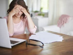 stock photo of woman showing stress about financial problems