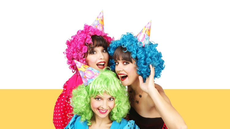 photo of three women wearing party hats and multicolored wigs from the Pro Legal Care LLC blog post about divorce party ideas