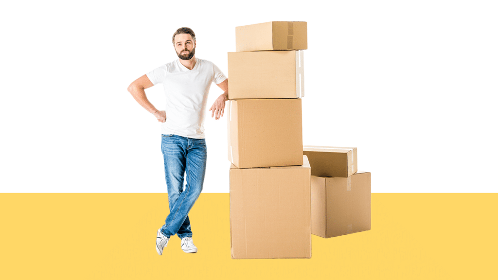 photo of man with stack of cardboard boxes