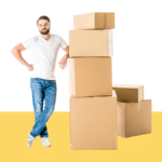 photo of man with stack of cardboard boxes
