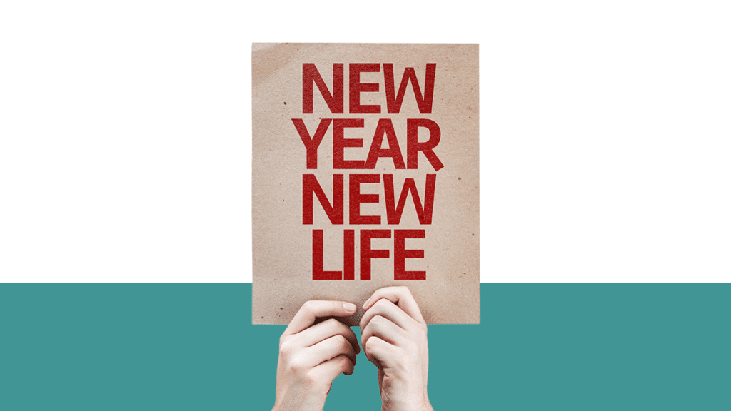 photo of two hands holding a sign that reads "New Year New Life" from the Pro Legal Care LLC blog post titled "Is January divorce month?"