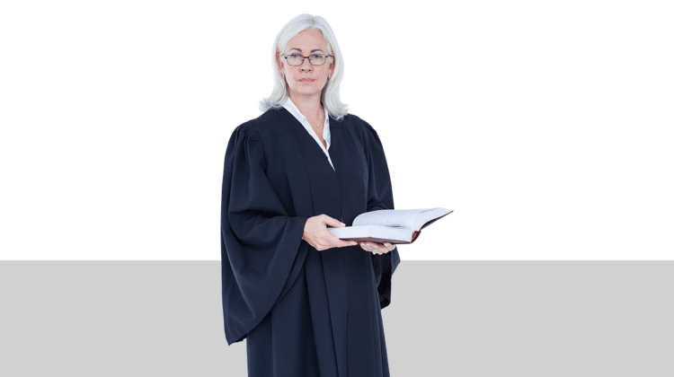 photo of a woman in judge's robes holding a book from Pro Legal Care LLC's blog post about trial for divorce