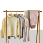photo of shirts and pants hanging from a clothes rack from blog post about how to dress in court