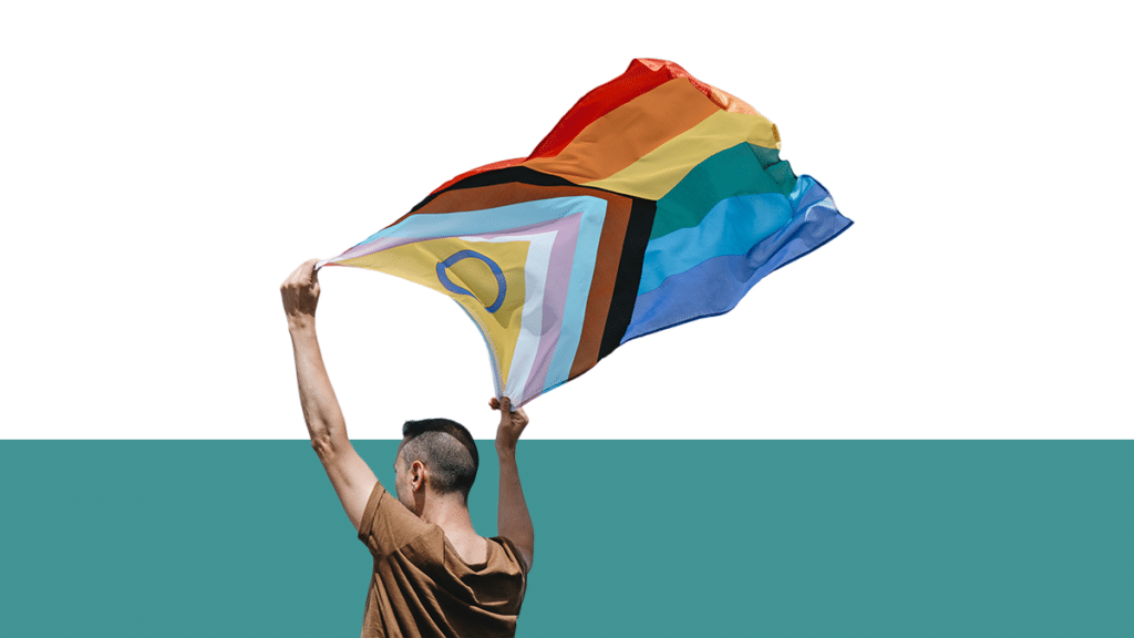 photo of person holding the Progress Pride Flag from Pro Legal Care LLC article titled "LGBTQIA+ Lawyer"