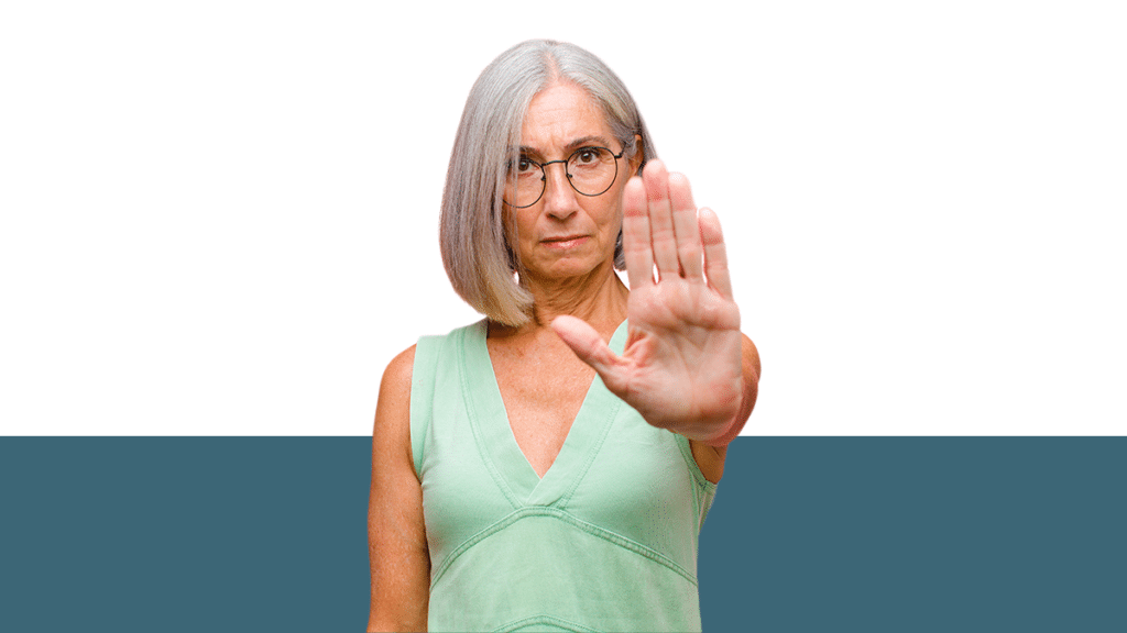 photo of woman holding her hand up to gesture "stop" from blog post about what is considered harassment by a co-parent