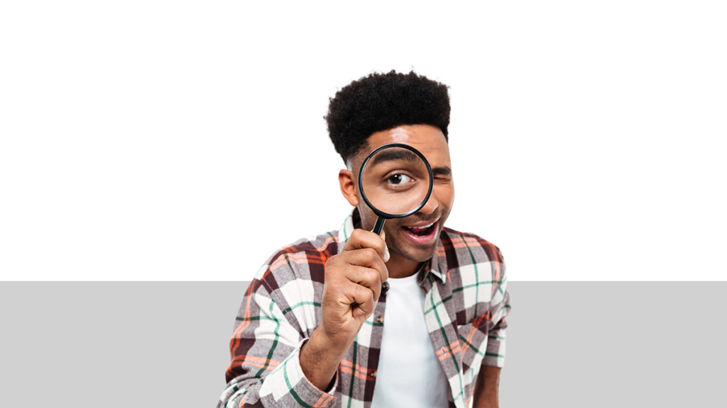 photo of a man holding a magnifying glass to his eye from a blog post about discovery in a divorce