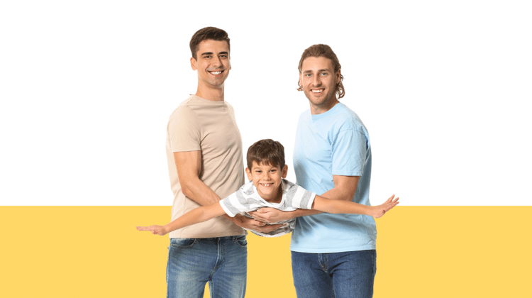 photo of two dads holding their young son from a blog post about second parent adoption