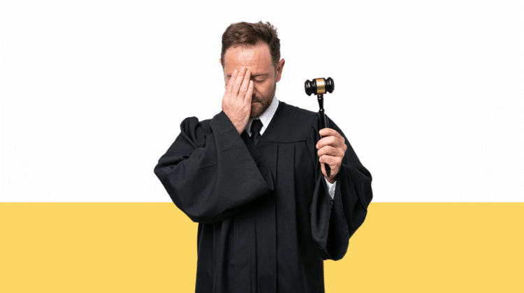 photo of a man in a judge's robe holding a gavel with his hand to his forehead in embarrassment from blog post about how to deal with a vexatious litigant in family court